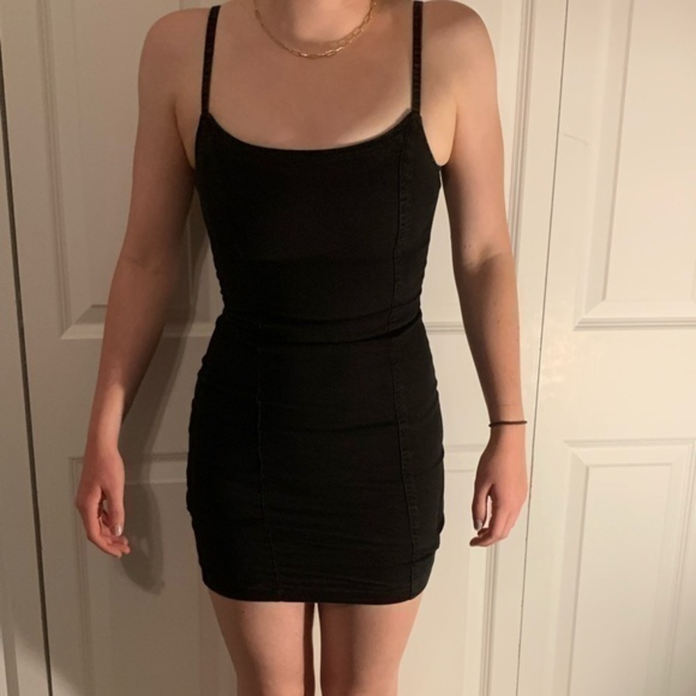 Junior black size xs mini dress with spaghetti straps, used.